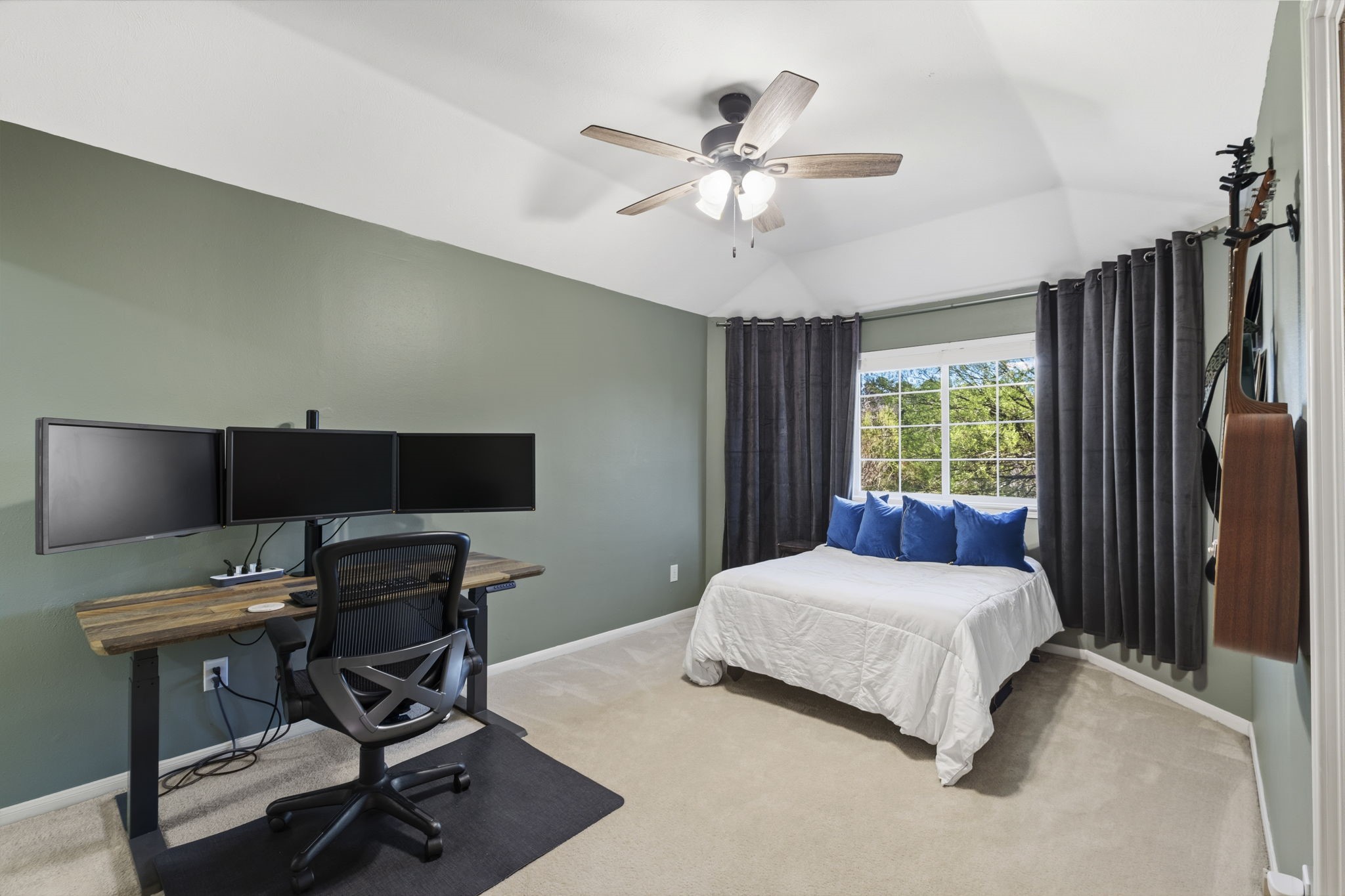 20322 Cembra Walk Spring, TX 77379 - Photo 25 of 47 a bedroom with a bed window and a flat screen tv