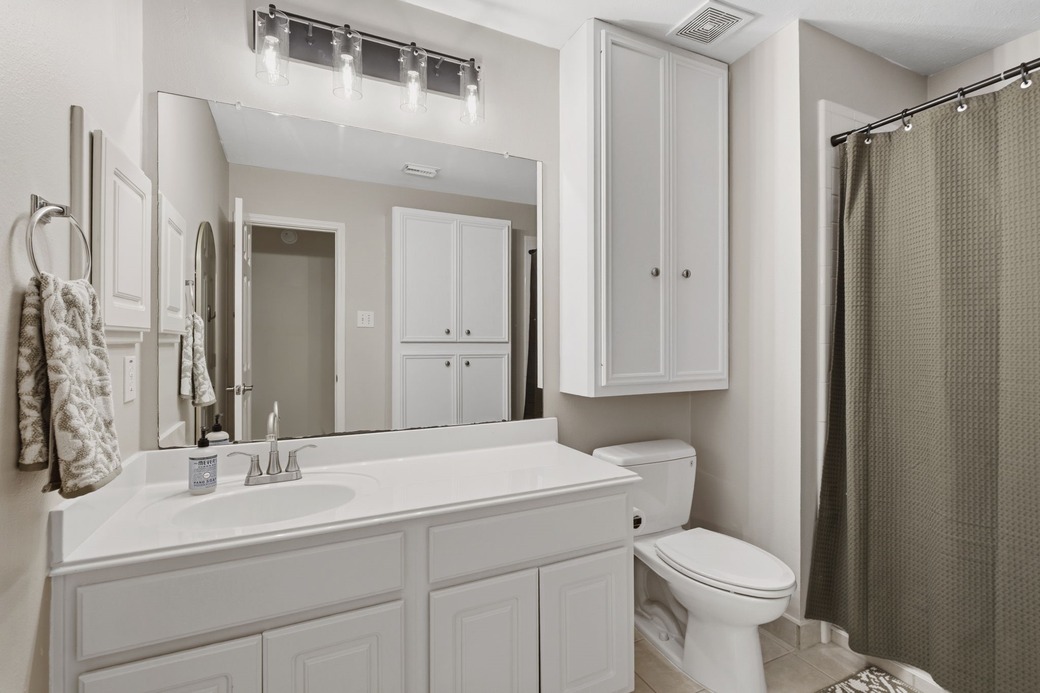 20322 Cembra Walk Spring, TX 77379 - Photo 27 of 47 a bathroom with a sink toilet and shower