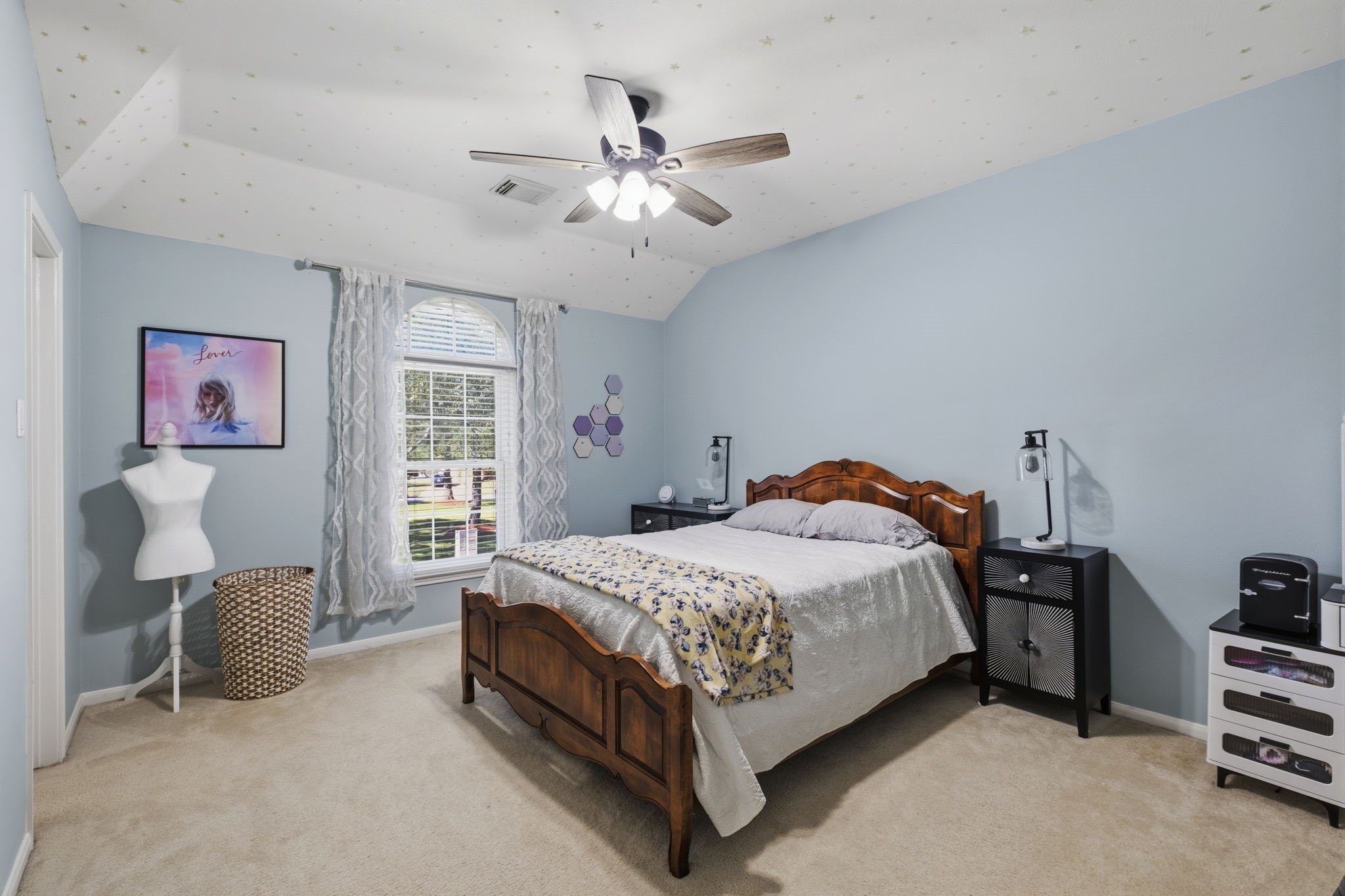20322 Cembra Walk Spring, TX 77379 - Photo 28 of 47 a bedroom with a bed and a chandelier
