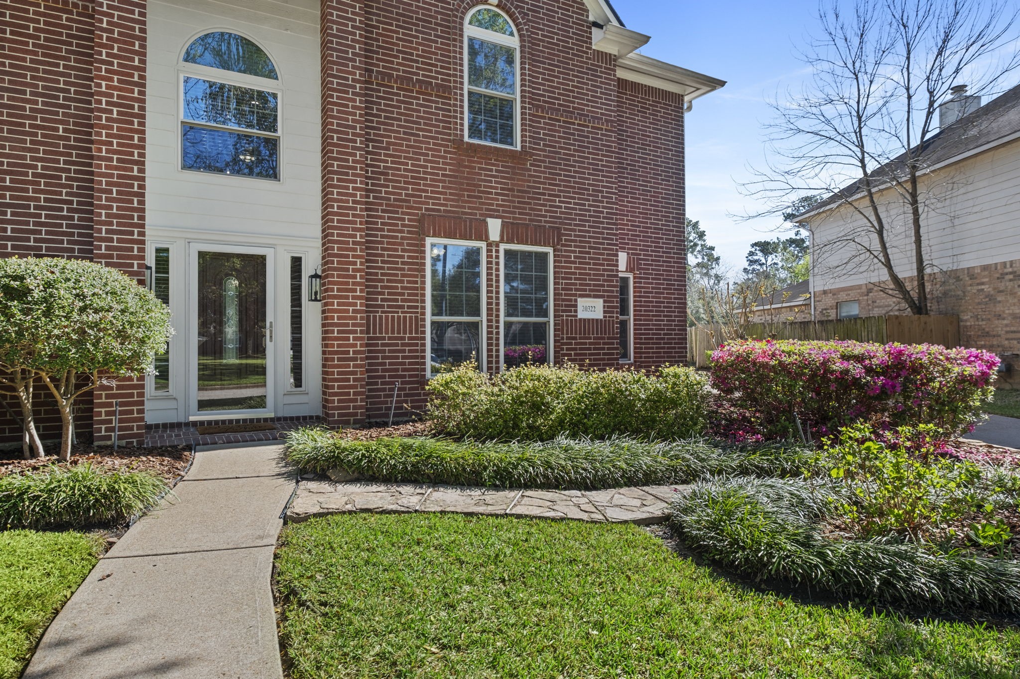 20322 Cembra Walk Spring, TX 77379 - Photo 4 of 47 a front view of a house with garden