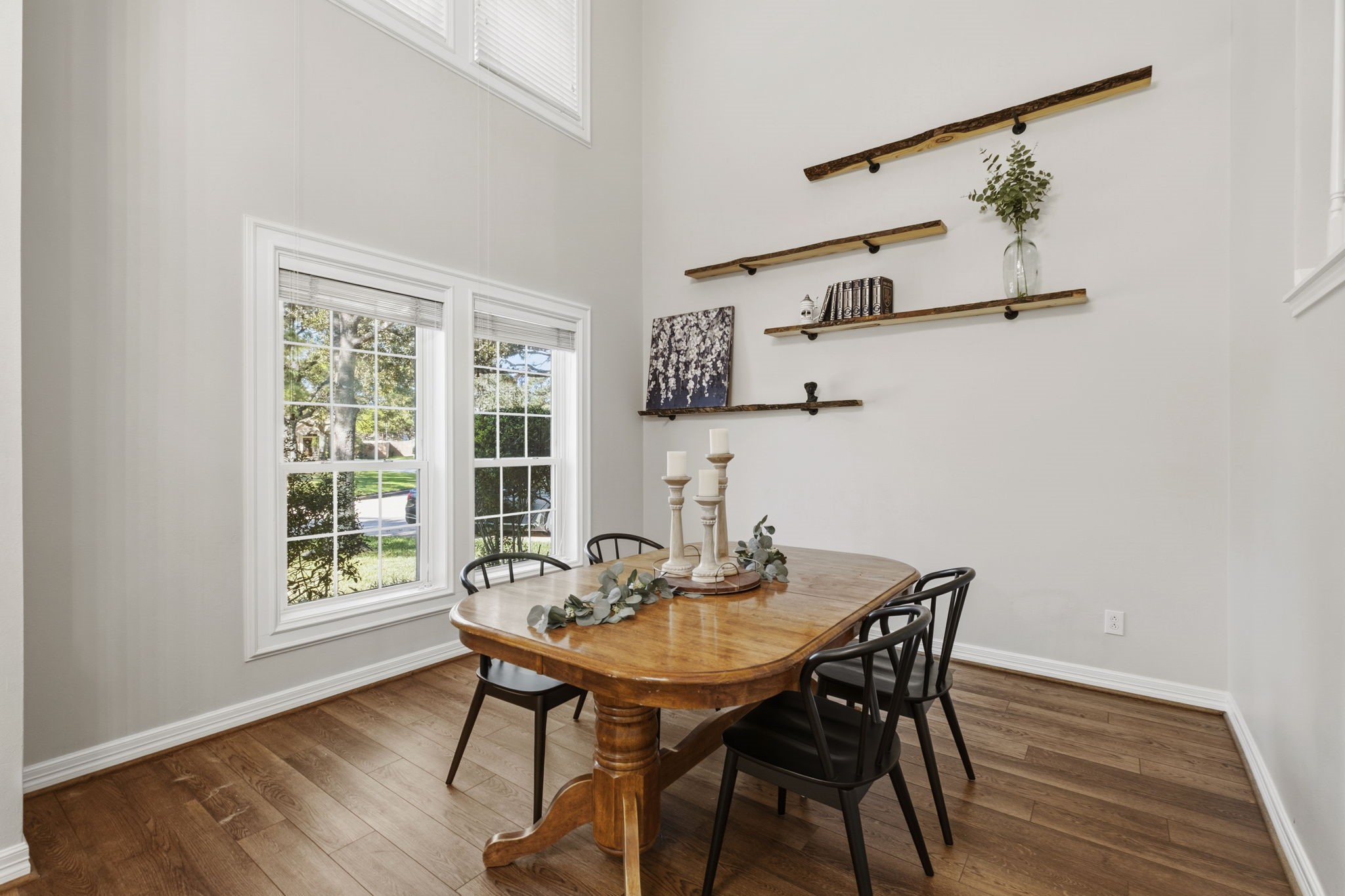 20322 Cembra Walk Spring, TX 77379 - Photo 7 of 47 a view of a dining room with furniture and wooden floor
