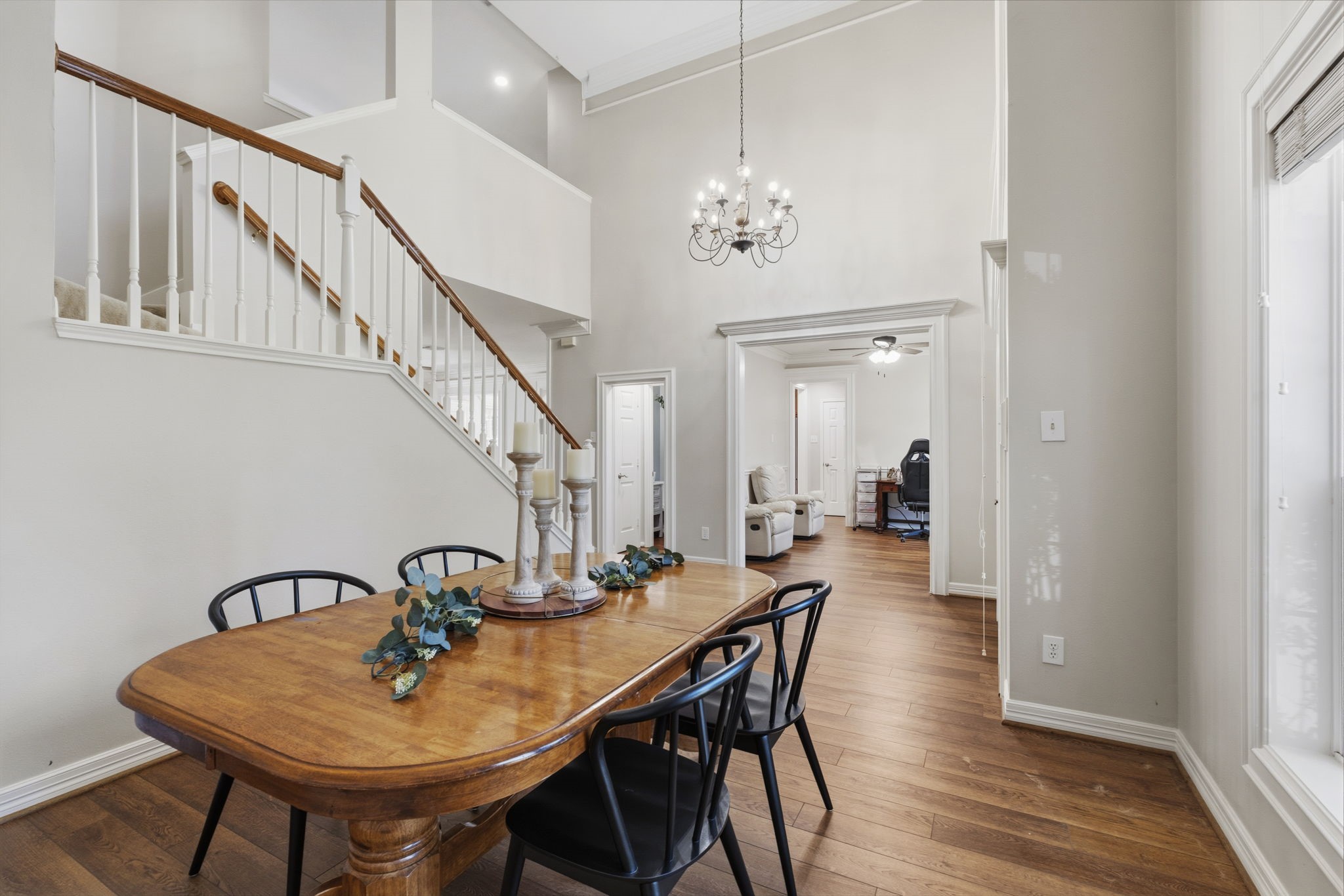20322 Cembra Walk Spring, TX 77379 - Photo 8 of 47 a view of a dining room with furniture and wooden floor