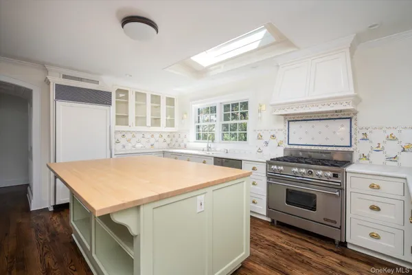 a kitchen with a stove and a microwave