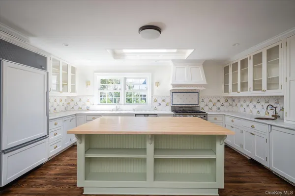 a kitchen with a stove and a window