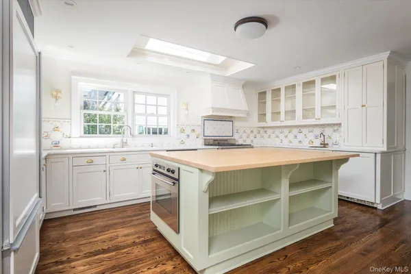 a kitchen with a stove and a sink