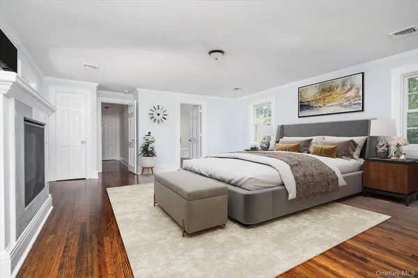 a spacious bedroom with a bed and a couch