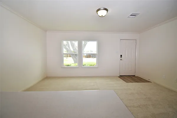 an empty room with windows