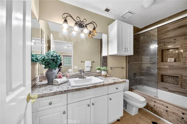 a balcony with table and chairs