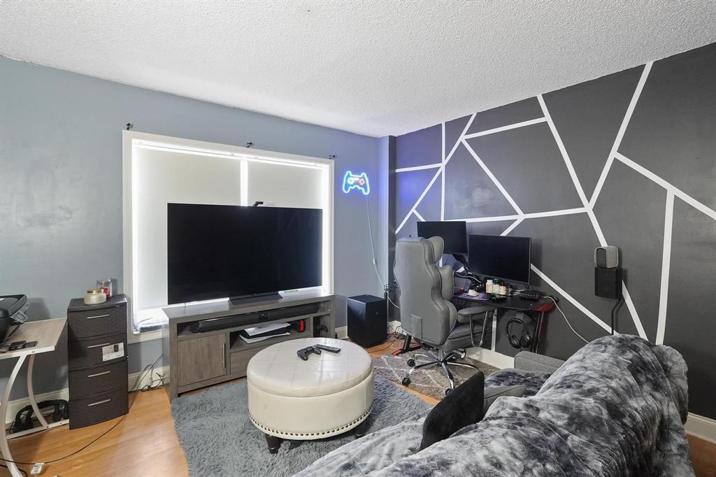 4174 Inverrary Drive, Unit 701 Lauderhill, FL 33319 - Photo 16 of 24 a living room with furniture and a flat screen tv