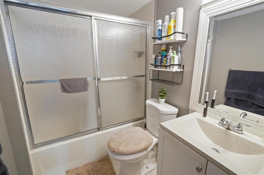 4174 Inverrary Drive, Unit 701 Lauderhill, FL 33319 - Photo 19 of 24 a bathroom with a sink a toilet and shower