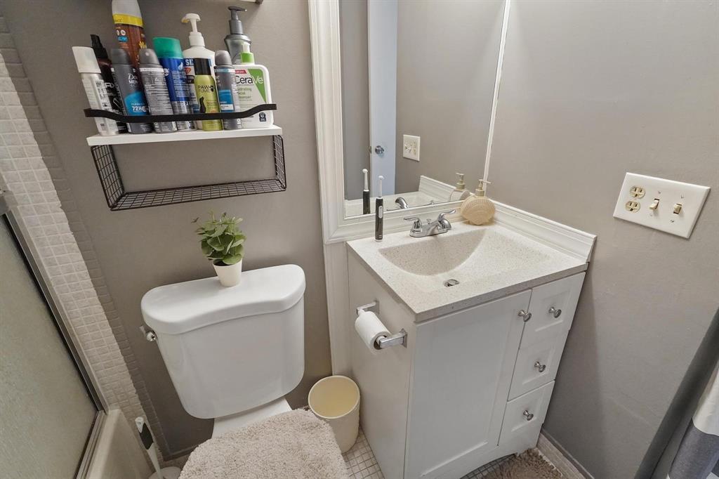 4174 Inverrary Drive, Unit 701 Lauderhill, FL 33319 - Photo 20 of 24 a bathroom with a sink toilet and mirror