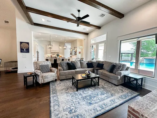 a living room with furniture or couch and a large window