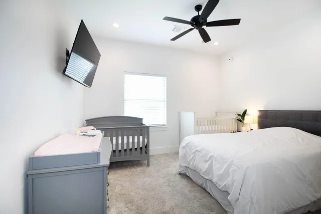 a bathroom with a double vanity sink toilet and shower