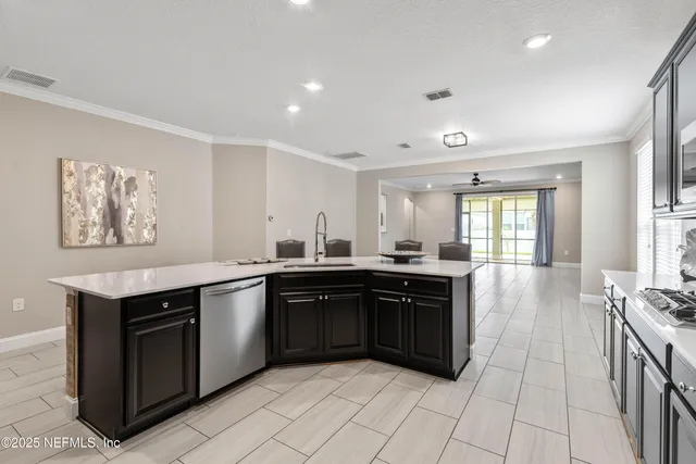 a view of a livingroom with furniture and a ceiling fan