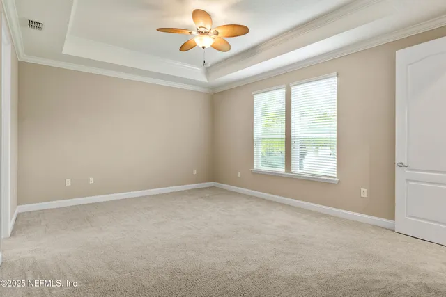 a view of an empty room with a flat screen tv