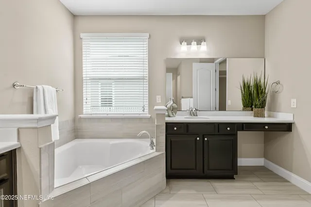a bathroom with a sink and mirror