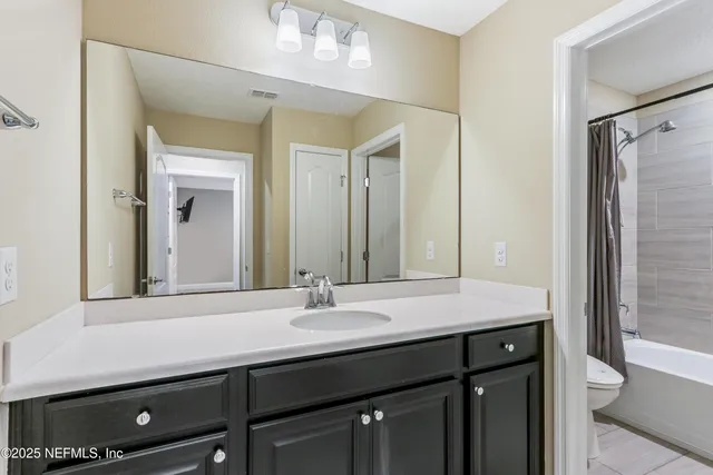 an aerial view of a house with a lake view