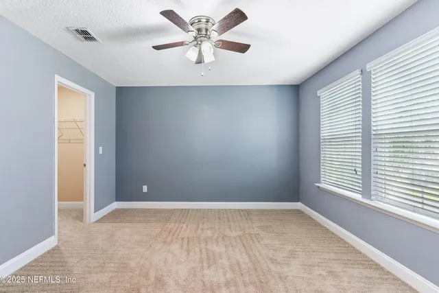 an aerial view of a house with a swimming pool