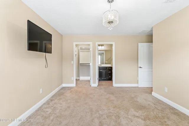 an aerial view of a house with a lake view