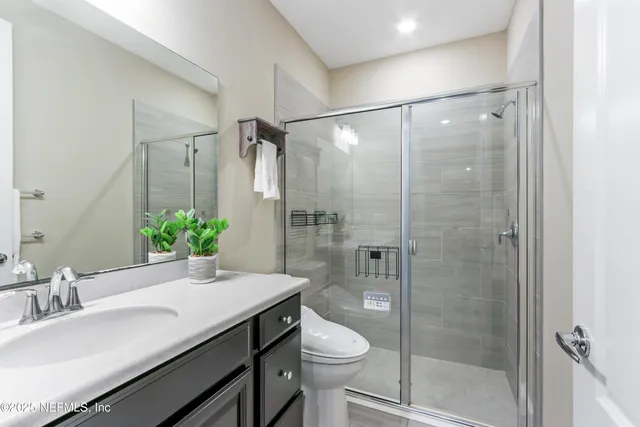 an aerial view of multiple houses with yard