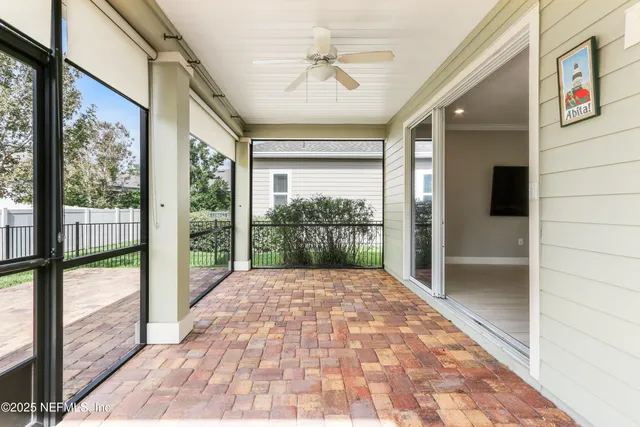 an aerial view of multiple houses with yard