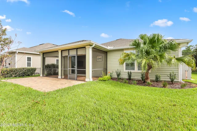 a view of an ocean and blue swimming pool
