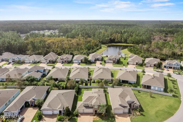 a view of a house with a yard and a garden