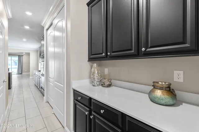 a view of a room with furniture and a flat screen tv