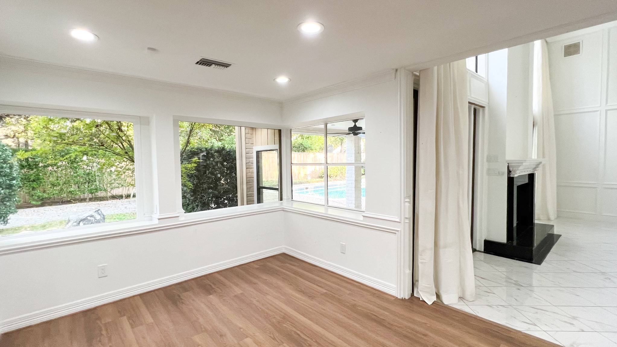 372 Robbins Drive Houston, TX 77024 - Photo 3 of 18 The breakfast room is quietly situated to the left of the living room and features stunning views of the backyard. Recently installed wide plank flooring flows throughout the home.