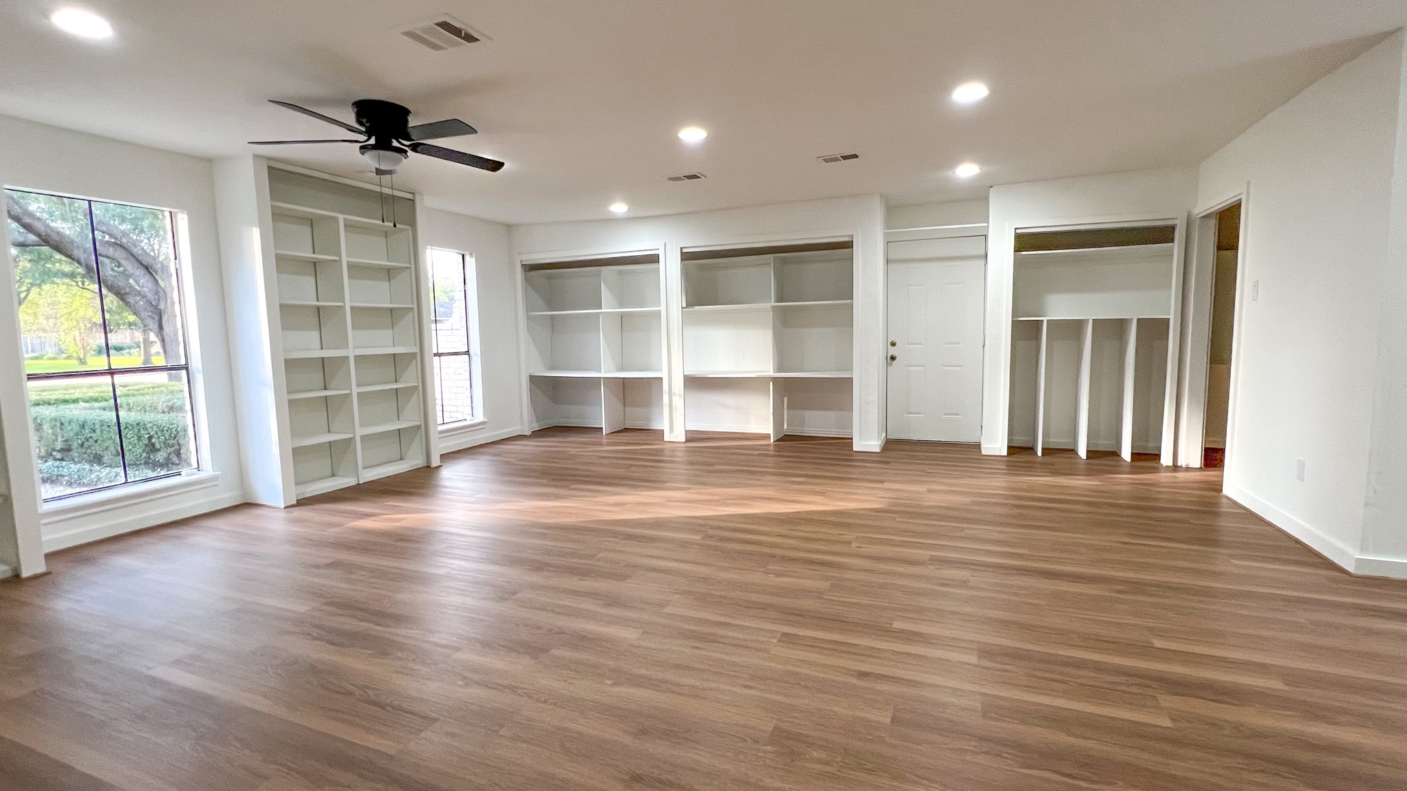 372 Robbins Drive Houston, TX 77024 - Photo 8 of 18 This impressive flex room serves as a seamless extension of the home's living areas. Custom built-ins provide abundant storage space, making this room ideal for a game room or study.
