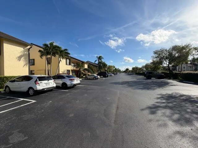 a view of street with parked cars