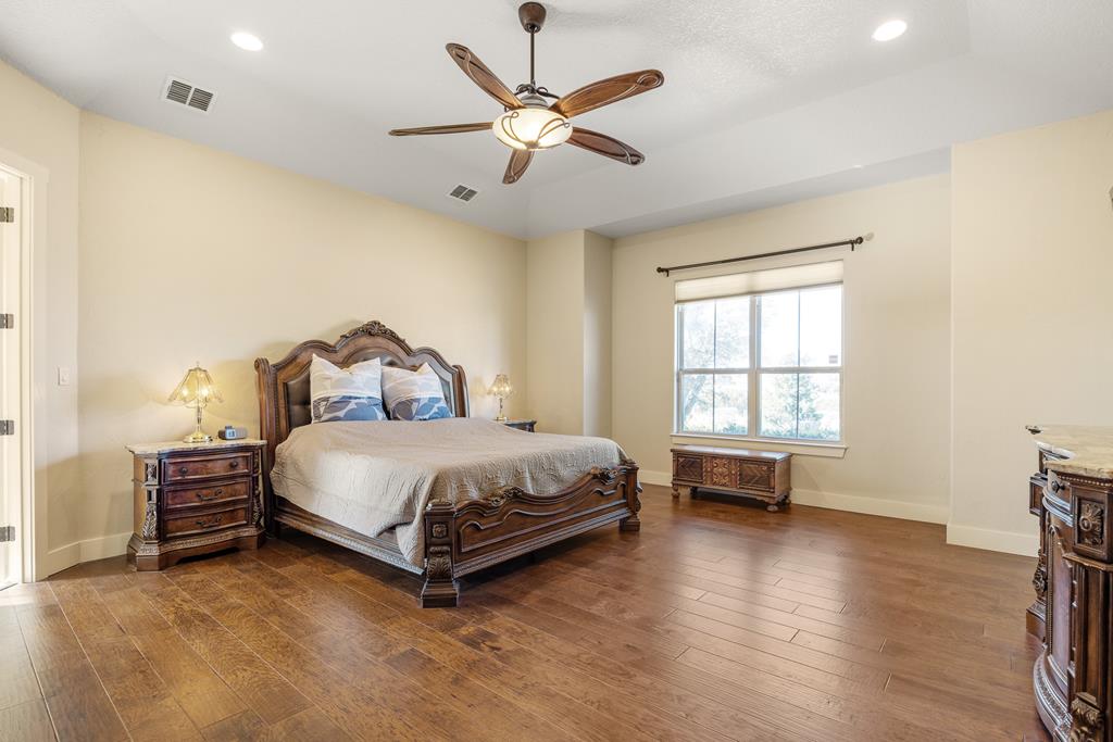 3704 Club View Court Kerrville, TX 78028 - Photo 11 of 25 a bedroom with a bed and a window
