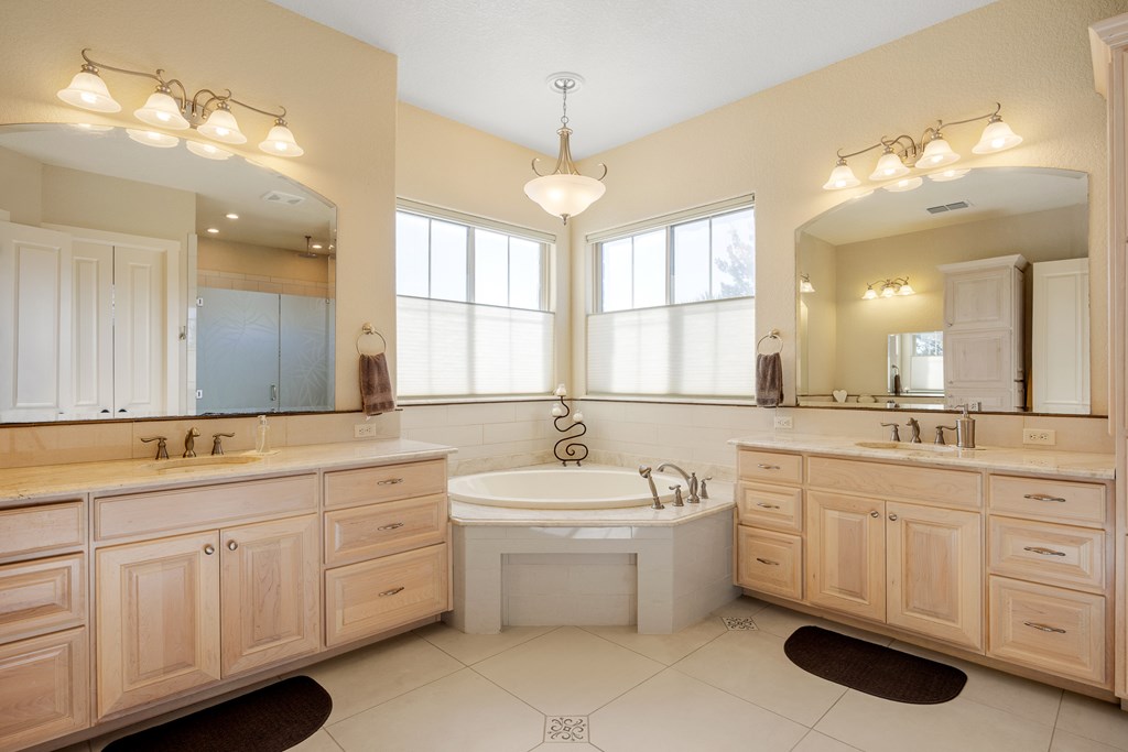 3704 Club View Court Kerrville, TX 78028 - Photo 12 of 25 a bathroom with a sink double vanity and a mirror