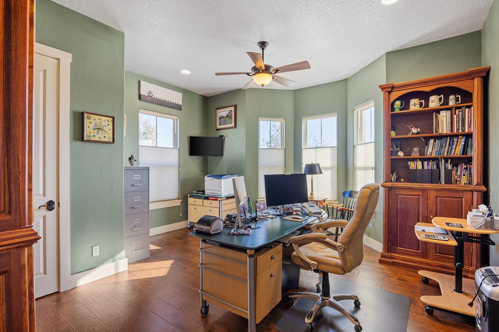 3704 Club View Court Kerrville, TX 78028 - Photo 13 of 25 a view of a workspace with furniture and a window