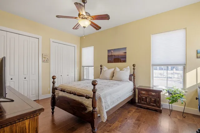 a bedroom with a bed and a tv