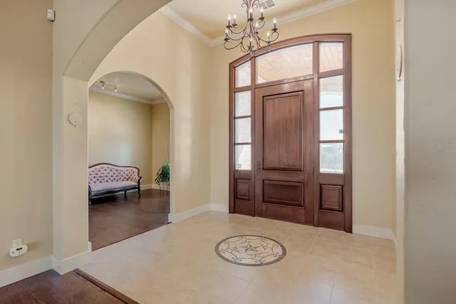 a view of a livingroom and a bedroom with furniture