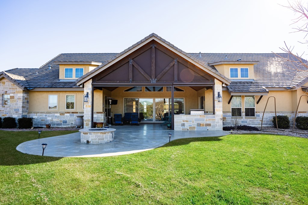 3704 Club View Court Kerrville, TX 78028 - Photo 22 of 25 a patio that has couches chairs and a big yard