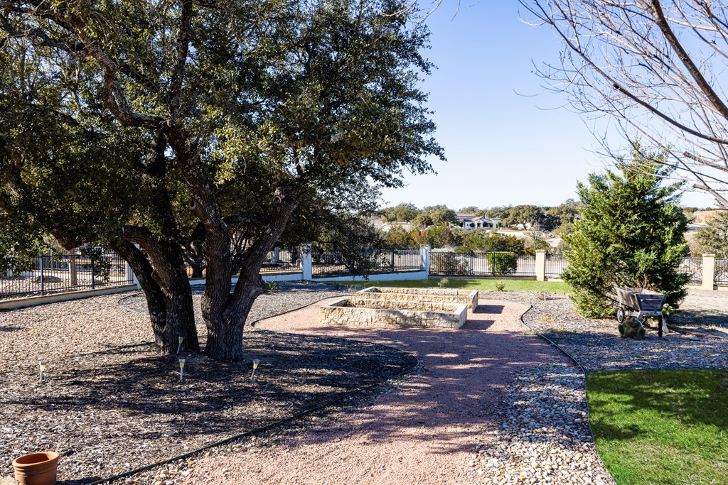 3704 Club View Court Kerrville, TX 78028 - Photo 23 of 25 a view of a yard with plants and trees