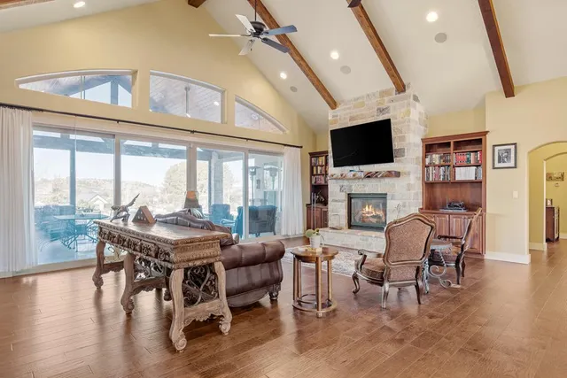 a view of a livingroom with furniture window and wooden floor