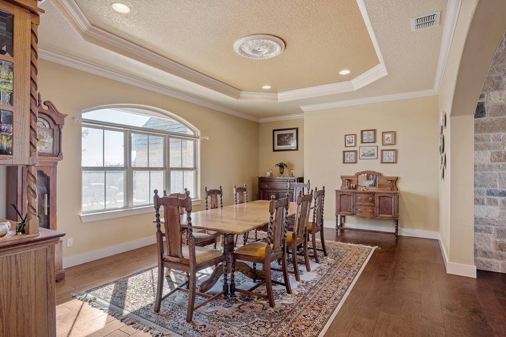 3704 Club View Court Kerrville, TX 78028 - Photo 10 of 25 a view of a dining room with furniture window and wooden floor