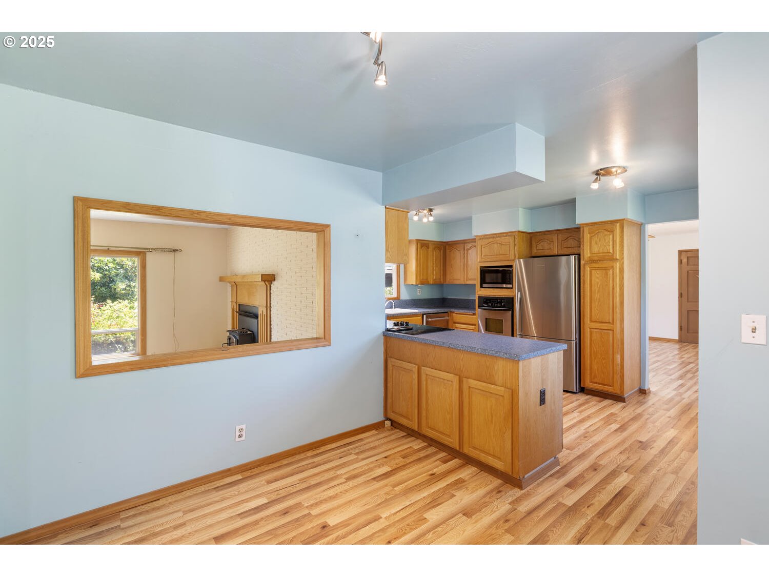 20068 South Ridge Road Oregon City, OR 97045 - Photo 12 of 47 a kitchen with stainless steel appliances granite countertop a refrigerator a sink dishwasher a stove and a wooden cabinets
