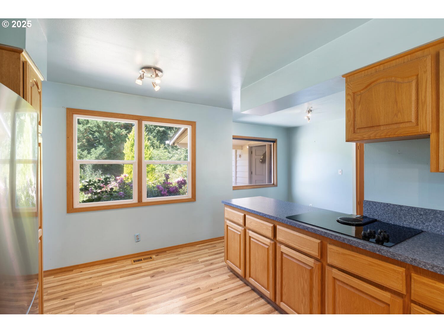 20068 South Ridge Road Oregon City, OR 97045 - Photo 14 of 47 a kitchen with kitchen island granite countertop a sink cabinets and window