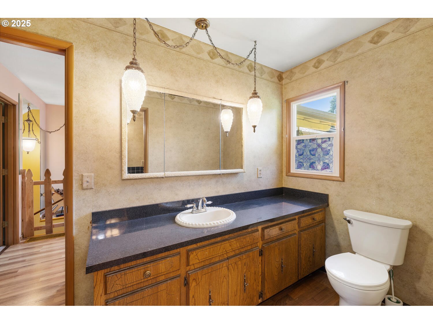 20068 South Ridge Road Oregon City, OR 97045 - Photo 18 of 47 a bathroom with a toilet a sink a mirror and a shower