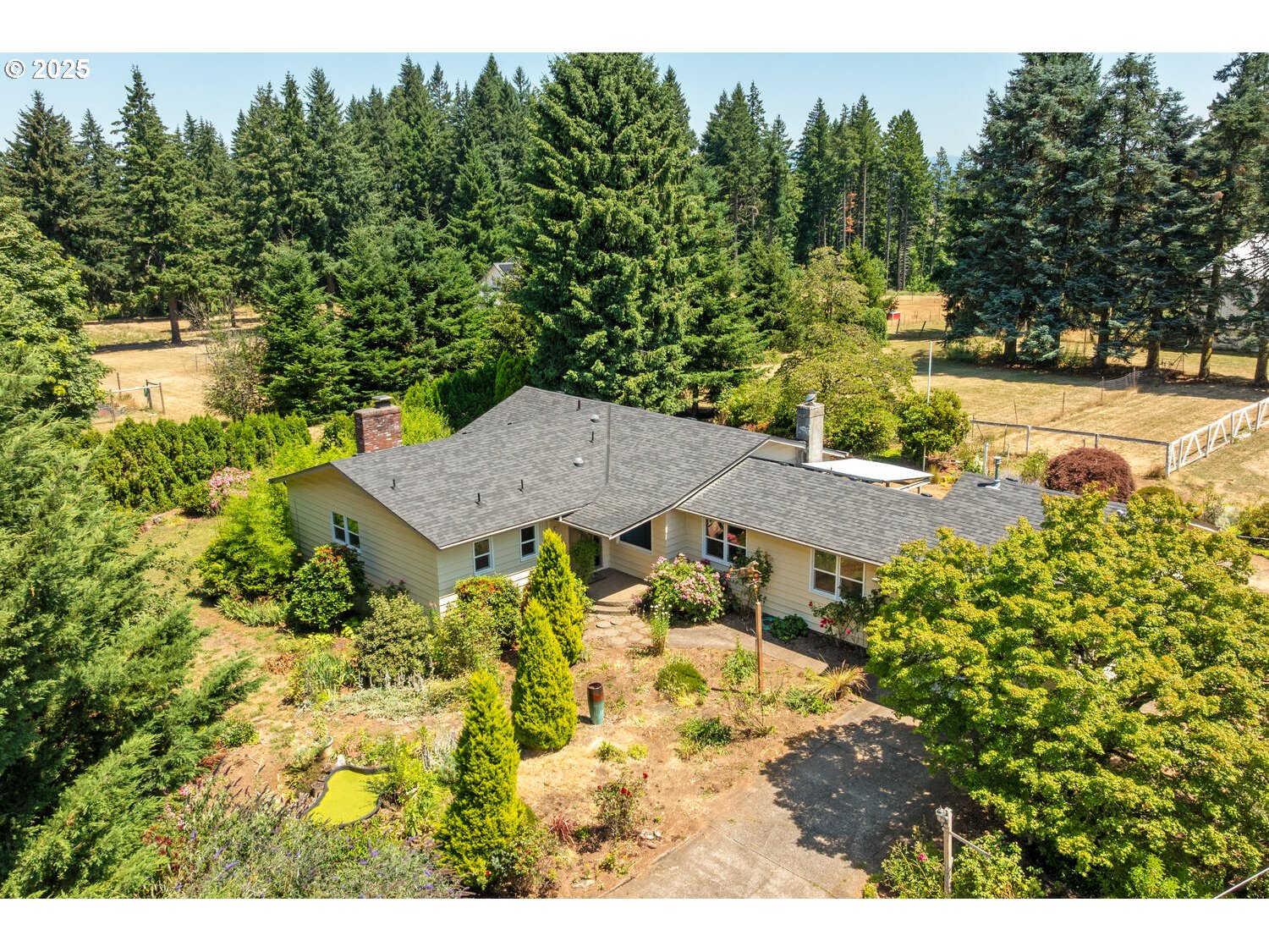 20068 South Ridge Road Oregon City, OR 97045 - Photo 2 of 47 a view of a house with a yard and sitting area