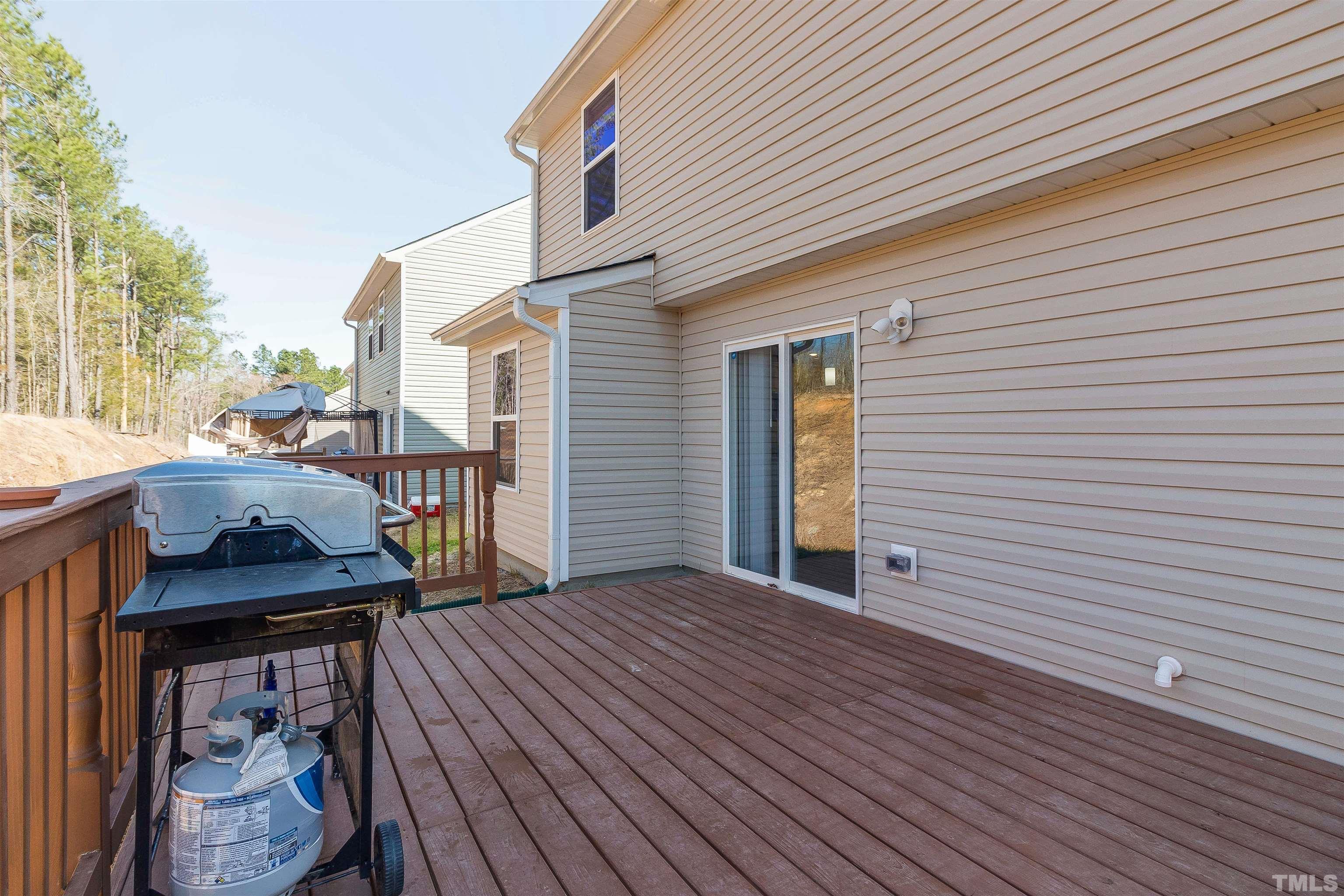 232 Rustling Way Zebulon, NC 27597 - Photo 14 of 14 a backyard of a house with seating space