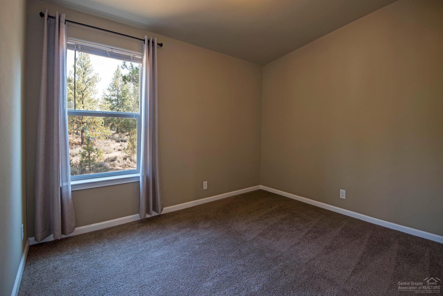 19770 Buck Canyon Road Bend, OR 97702 - Photo 6 of 23 This is the den/office, just off the gre