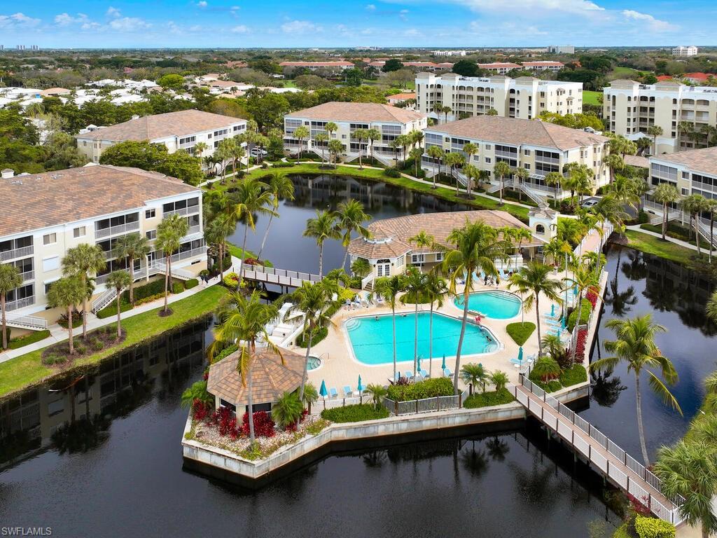 7655 Pebble Creek Circle, Unit 404 Naples, FL 34108 - Photo 19 of 19 an aerial view of residential houses with outdoor space