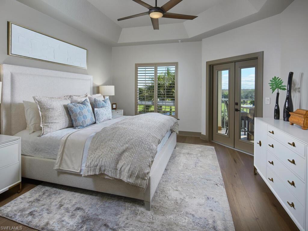 7655 Pebble Creek Circle, Unit 404 Naples, FL 34108 - Photo 9 of 19 a spacious bedroom with a bed and window