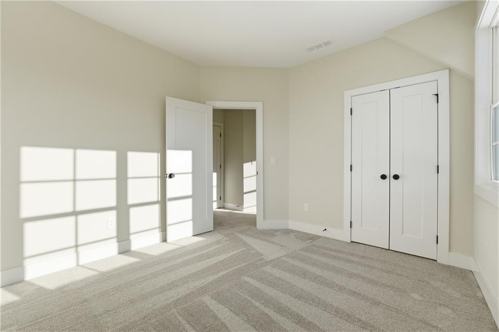 157 Palisade Drive Rydal, GA 30171 - Photo 49 of 68 an empty room with windows and closet