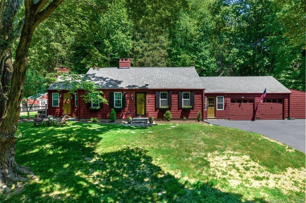 Enchanting country ranch, set back from road on beautiful 4 acres complete with garden area and chicken coop!